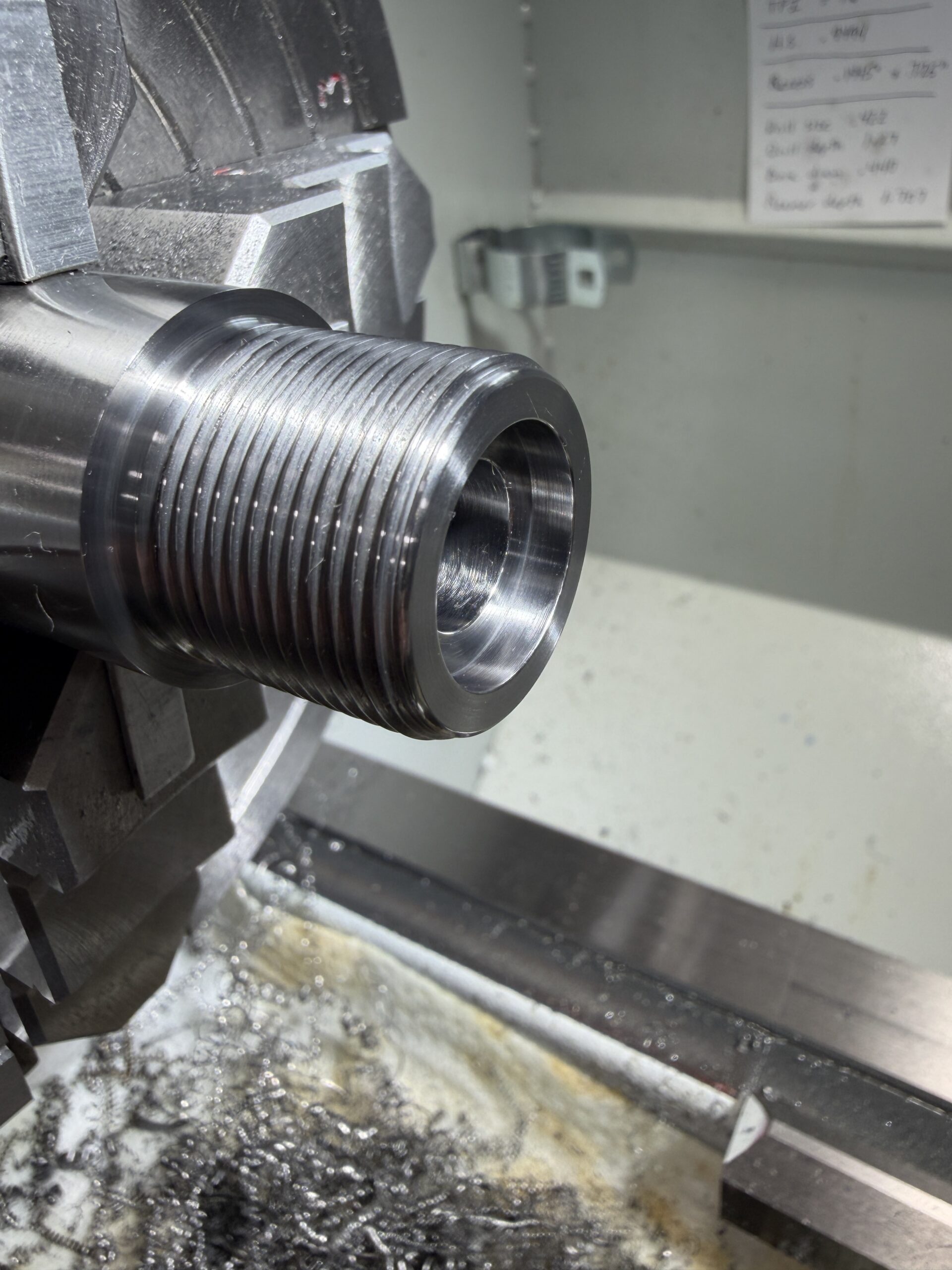 Close view of precision barrel machining in the shop
