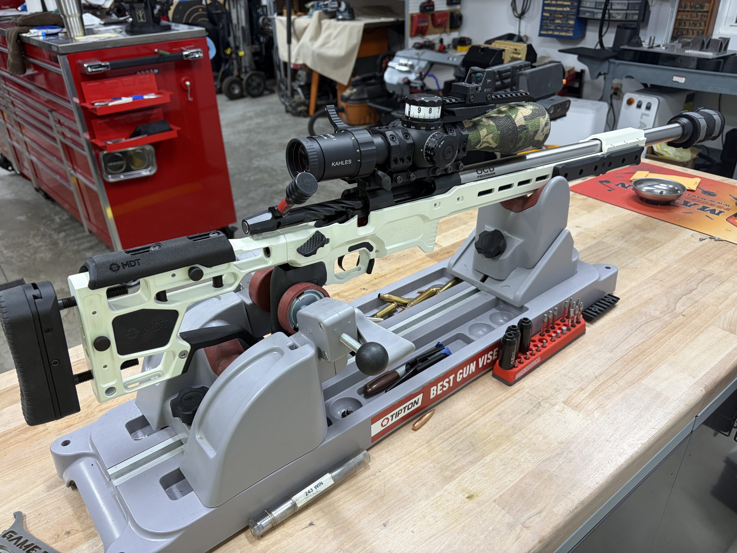 Precision competition rifle secured on a bench rest in the shop